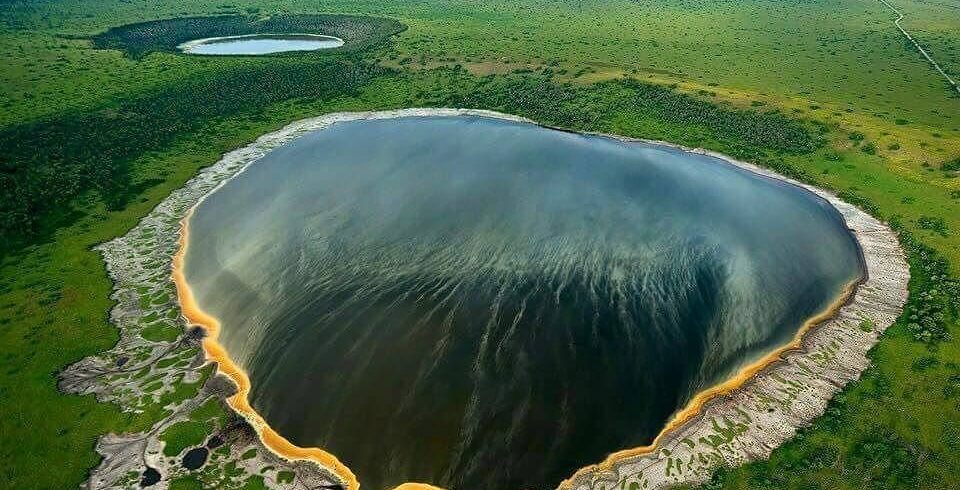 Aerial view of Ngorongoro Crater with wildlife grazing on the crater floor during Tanzania safari